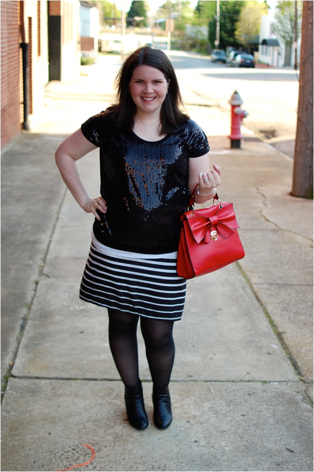 maternity style - black sequin shirt, black and white striped skirt, red bow bag, and Hanes tights