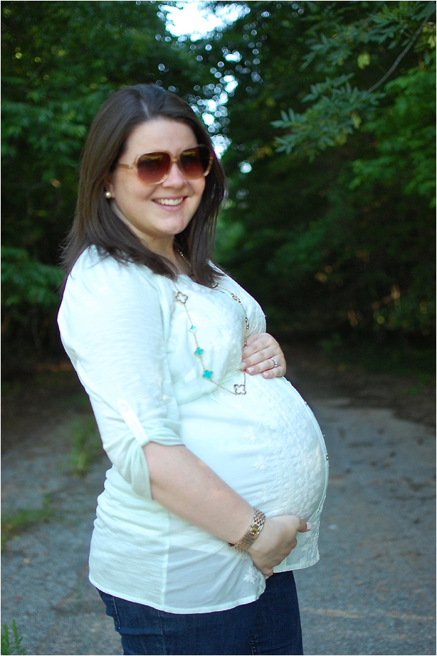 maternity style: mint tunic, jeans, purple bag, TOMS sunglasses